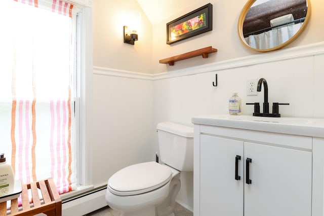 full bath featuring vanity, toilet, wainscoting, and a baseboard radiator