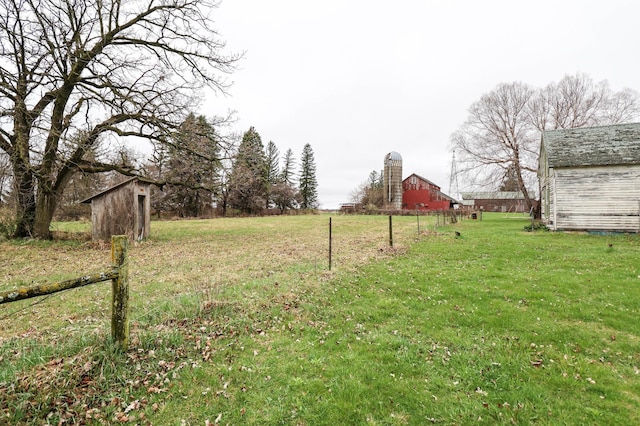 view of yard featuring a barn and an outbuilding