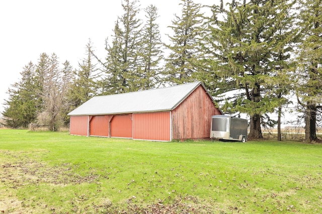 view of pole building with a lawn