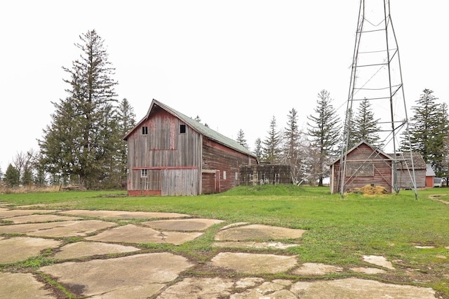 view of yard featuring a barn and an outdoor structure