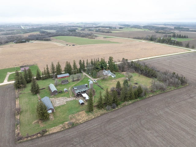 birds eye view of property with a rural view