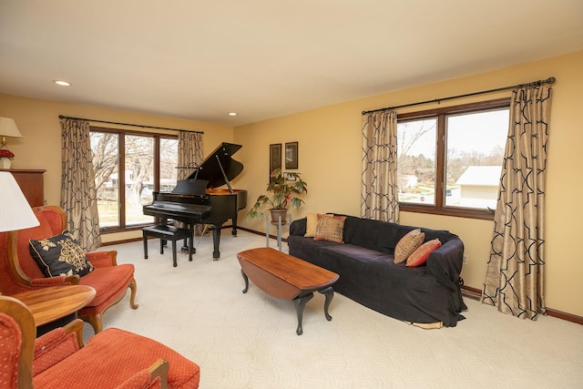 living area with recessed lighting, baseboards, and carpet
