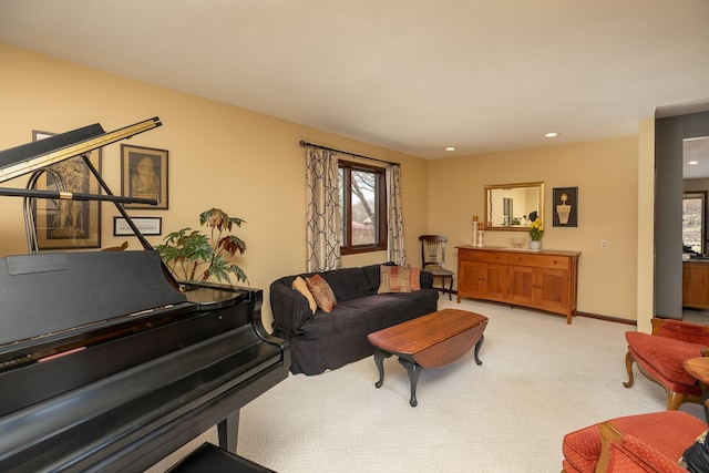sitting room with light colored carpet, recessed lighting, baseboards, and a wealth of natural light