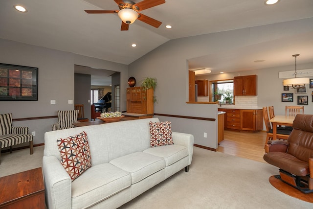 living area with ceiling fan, light carpet, recessed lighting, and lofted ceiling