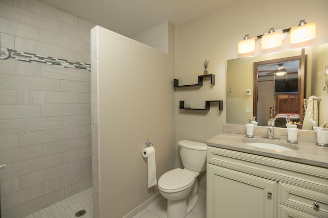 full bathroom featuring walk in shower, vanity, toilet, tile patterned floors, and a ceiling fan
