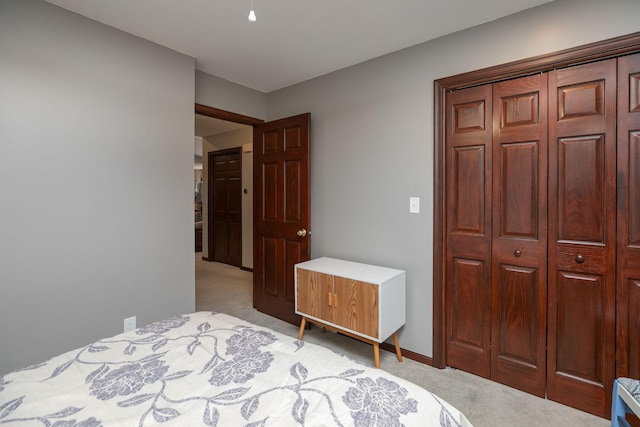 carpeted bedroom with a closet