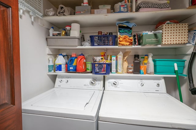 laundry room with washing machine and clothes dryer