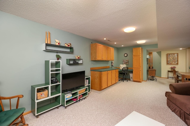 living room with recessed lighting, a textured ceiling, light colored carpet, and baseboards