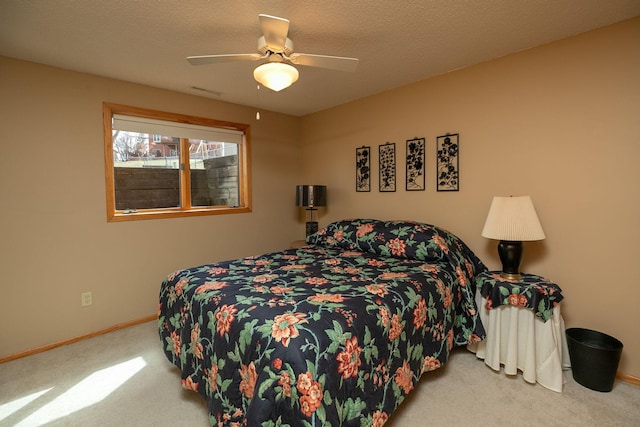 bedroom featuring baseboards, carpet, and a ceiling fan