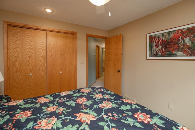 bedroom with a closet, recessed lighting, ceiling fan, and visible vents