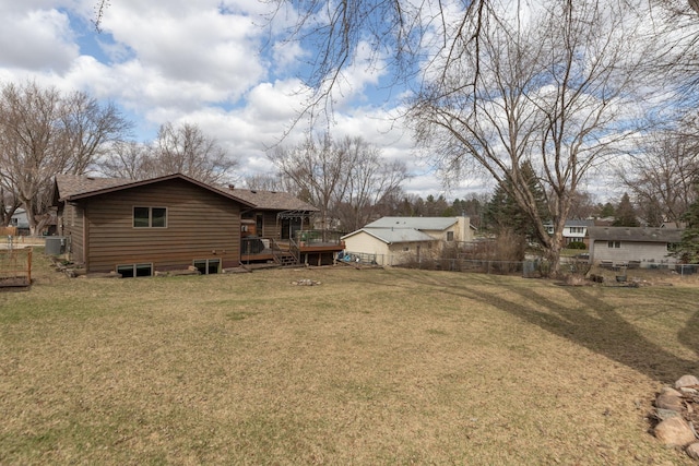 view of yard featuring a deck and fence