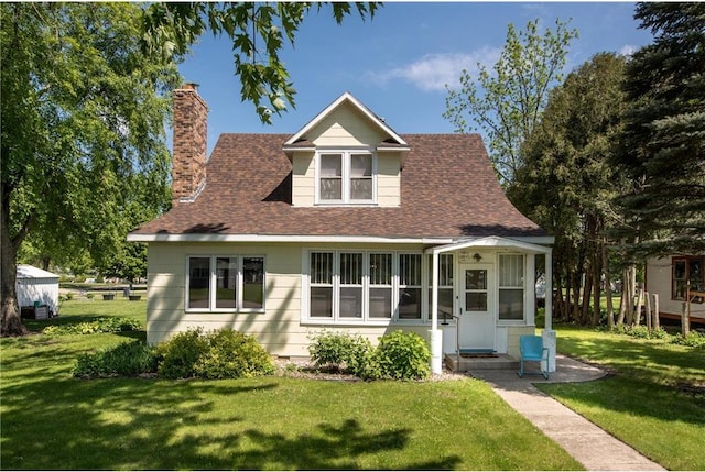 106 4th St, Cyrus, MN 56323 - bungalow with a front lawn, a shingled roof, and a chimney