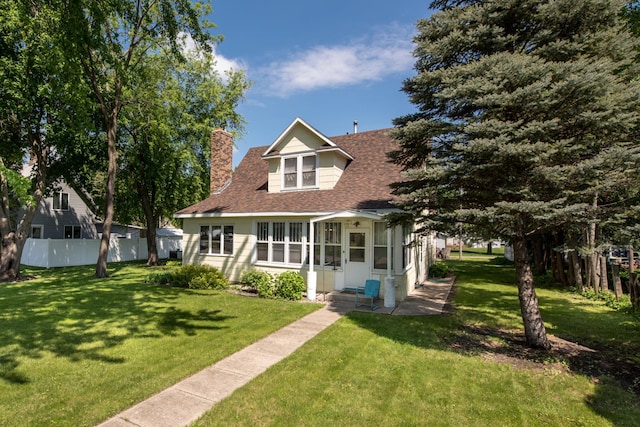 106 4th St, Cyrus, MN 56323 - bungalow-style house featuring a chimney, roof with shingles, a front lawn, and fence