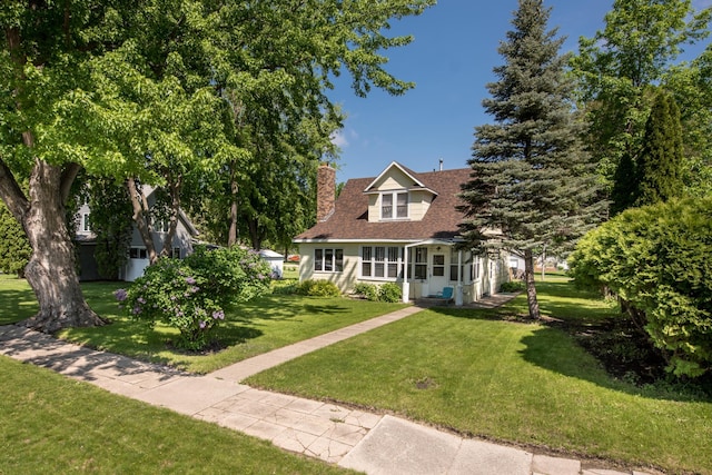 106 4th St, Cyrus, MN 56323 - cape cod-style house with roof with shingles, a front lawn, and a chimney