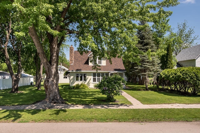 106 4th St, Cyrus, MN 56323 - cape cod home with a chimney, a front lawn, and fence