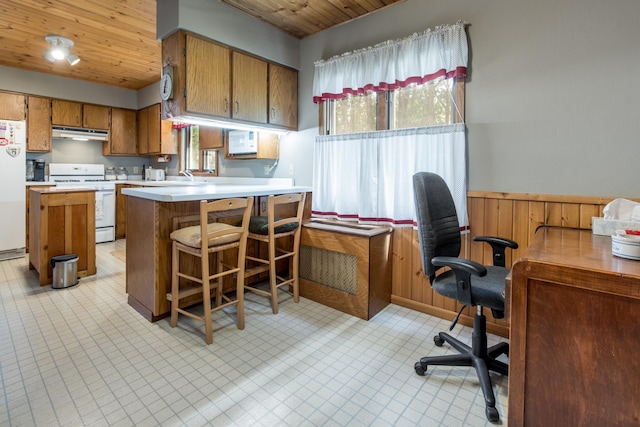 106 4th St, Cyrus, MN 56323 - kitchen with white appliances, brown cabinets, under cabinet range hood, light countertops, and wood ceiling