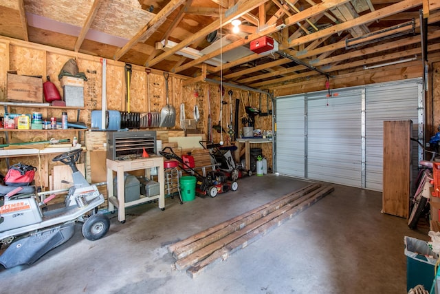 106 4th St, Cyrus, MN 56323 - garage with a workshop area and a garage door opener