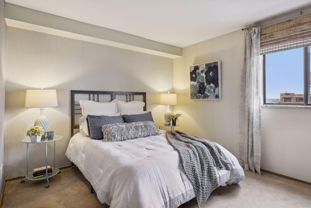 carpeted bedroom with baseboards