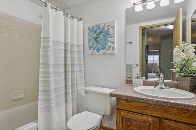 full bath with vanity, shower / bath combo with shower curtain, and toilet