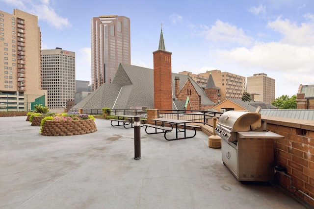 view of patio / terrace featuring a city view and area for grilling