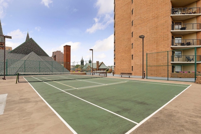 view of sport court featuring fence and community basketball court