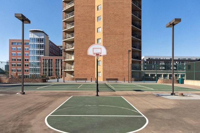 view of basketball court with fence and community basketball court