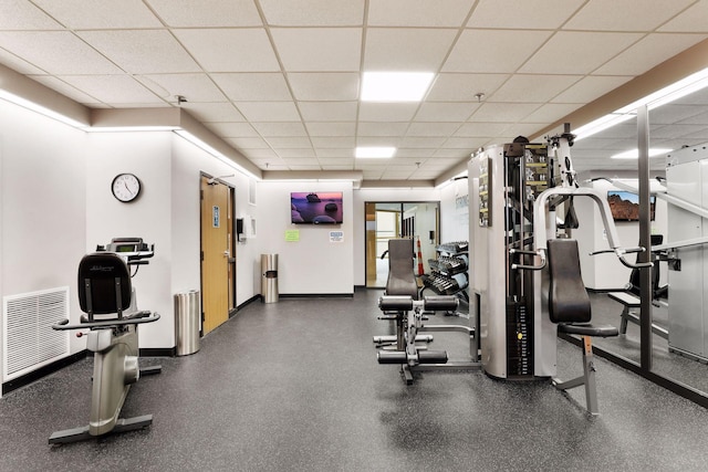 exercise room featuring visible vents and a drop ceiling