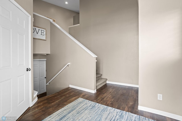 staircase with baseboards, recessed lighting, and wood finished floors