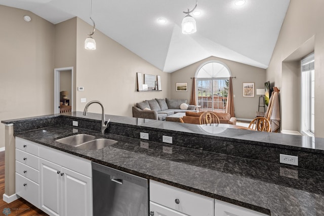 kitchen featuring a sink, open floor plan, dark wood-type flooring, stainless steel dishwasher, and vaulted ceiling
