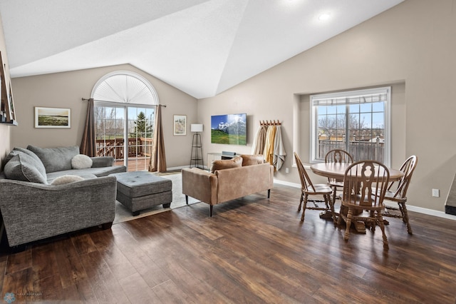 living area with a healthy amount of sunlight, baseboards, vaulted ceiling, and dark wood-style floors