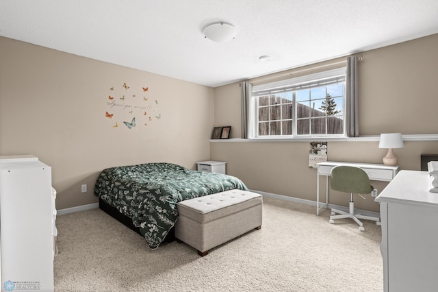 bedroom featuring baseboards and carpet flooring