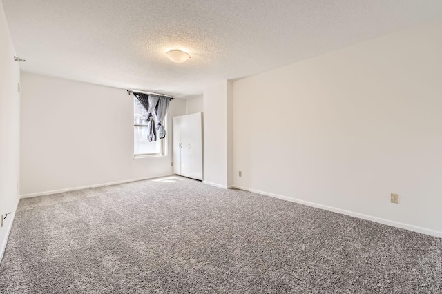 401 1st St Unit 414, Minneapolis, MN 55401 - carpeted spare room with a textured ceiling and baseboards