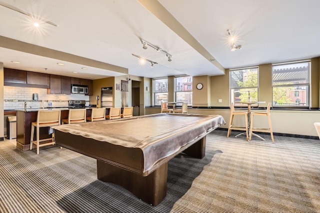 401 1st St Unit 414, Minneapolis, MN 55401 - playroom with light carpet, billiards, track lighting, baseboards, and recessed lighting