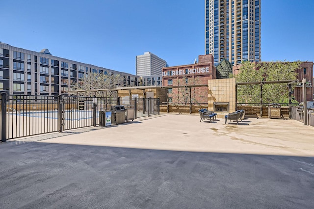 401 1st St Unit 414, Minneapolis, MN 55401 - view of patio with a fireplace and fence