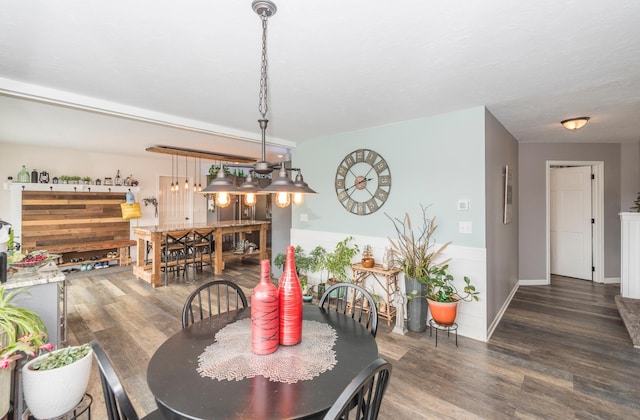 dining space with wood finished floors