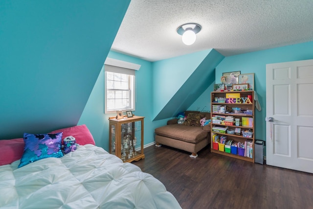 bedroom featuring a textured ceiling and wood finished floors