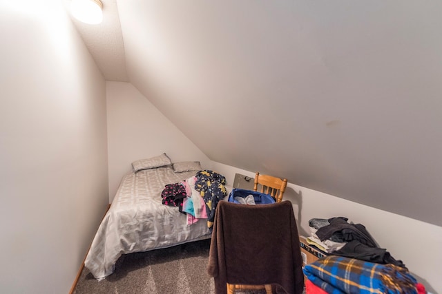 carpeted bedroom featuring vaulted ceiling
