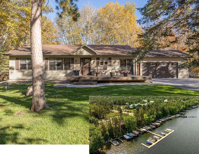 ranch-style house with a water view, a garage, a front yard, and aphalt driveway