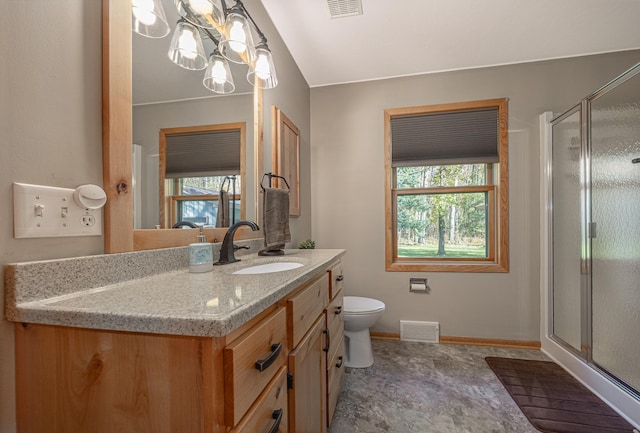 bathroom featuring a wealth of natural light, a shower stall, and visible vents