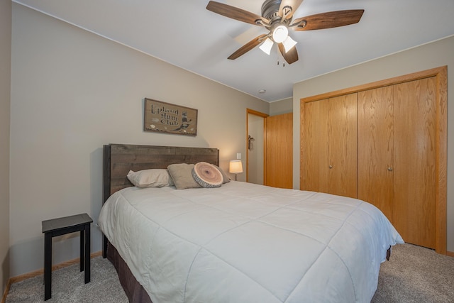 bedroom featuring a closet, baseboards, ceiling fan, and carpet flooring