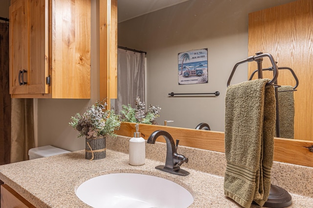 bathroom with vanity and a shower with shower curtain