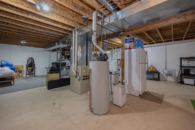 unfinished basement featuring water heater, heating unit, and freestanding refrigerator