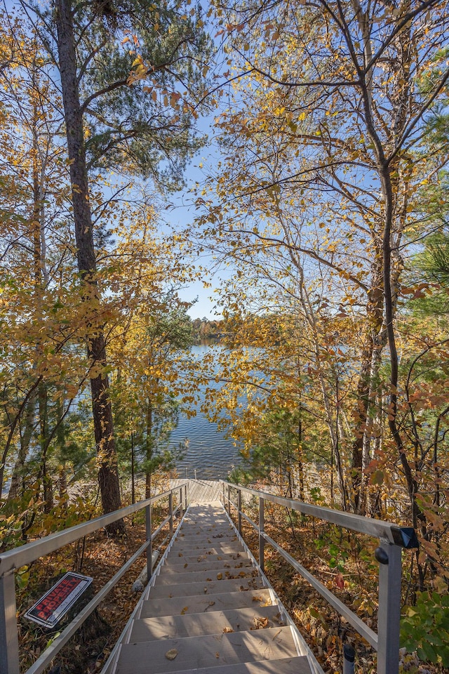 surrounding community with a water view