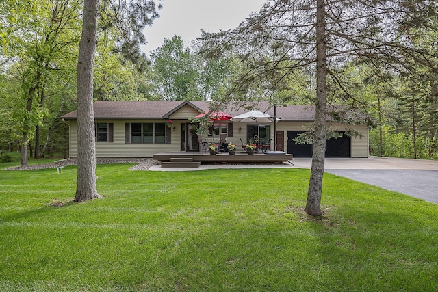 37138 Blacksmith Pl, Crosslake, MN 56442 - single story home featuring concrete driveway, a front lawn, a deck, a garage, and a shingled roof