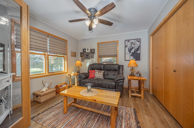 37138 Blacksmith Pl, Crosslake, MN 56442 - living room with light wood-style flooring, ceiling fan, and baseboards