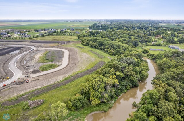 aerial view with a water view and a rural view