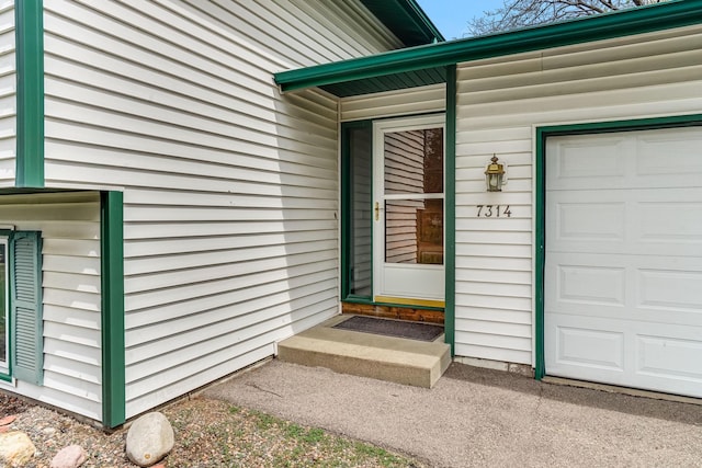 doorway to property featuring a garage