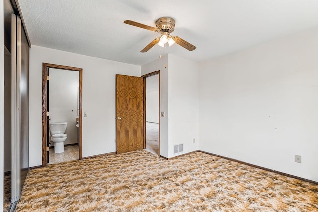 unfurnished bedroom with ceiling fan, ensuite bath, carpet, baseboards, and visible vents