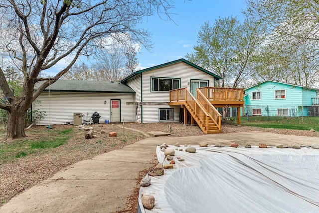 view of front of property with stairs and a deck