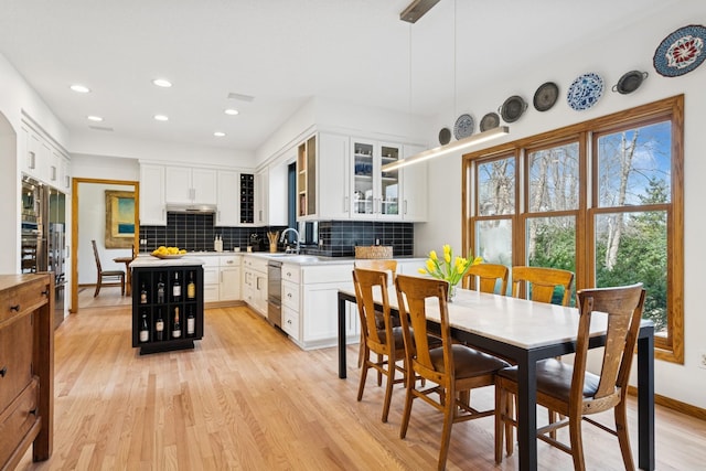 3412 Williamsburg Pkwy, Woodbury, MN 55129 - dining room with recessed lighting, light wood finished floors, and baseboards